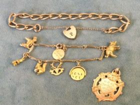 A 9ct gold bracelet with seven charms - a squirrel holding a pearl, a pig, a rabbit, a terrier, a