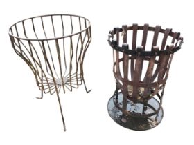 A circular wrought iron garden brazier on angled legs; and another similar of metal strapwork