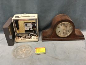 An oak cased Nelsons hat shaped chiming mantel clock, the convex glazed circular dial with brass