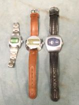 Three 1970s jump hour gents wristwatches with straps - Zoniku, American Heritage and Hanowa, all