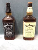 A litre bottle of Jack Daniels Old No 7 Tennessee sour mash whiskey; and a litre bottle of Jack