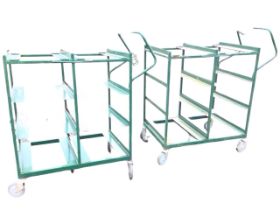 A pair of rectangular metal trolleys designed to support eight trays with handles to sides, each