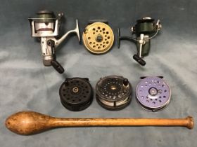 An unmarked 3.75in old salmon fly reel with line; two spinning reels - Diawa long cast and Ryobi