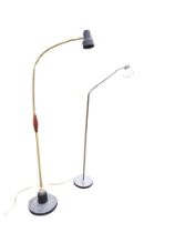 A weighted reading lamp with hardwood handle and adjustable brass snake arm supporting spotlight;