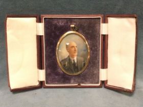 An Edwardian miniature of a gentleman, the bust portrait in oval gilt frame, unsigned, mounted in