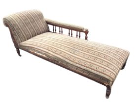 A late nineteenth century mahogany chaise longue with original striped moquette upholstery, the