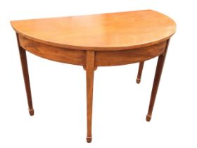 A C19th mahogany demi-lune hall table, the top above a plain apron, raised on tapering square legs