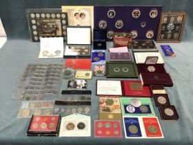 A collection of coins and medals including USA proof sets for 1982 & 1986, a cased 1988 USA