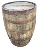 An oak whiskey barrel, the staves bound by six riveted metal strap bands. (34.75in)