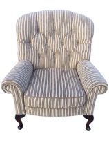 A contemporary button upholstered armchair by Wade, with wide arched back and scrolled padded arms