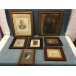 A collection of framed Victorian and Edwardian photographic family portraits including