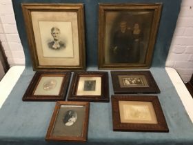 A collection of framed Victorian and Edwardian photographic family portraits including