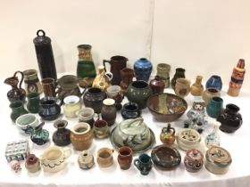 A collection of studio and art pottery - jugs, vases, mugs, ginger jars, bowls, a cheese dish, a