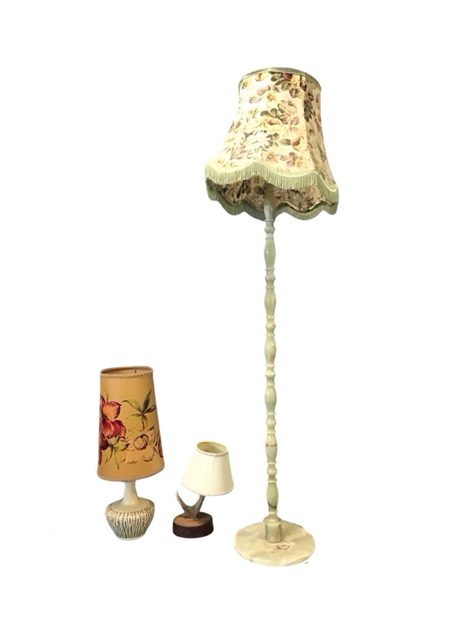 An onyx standard lamp, the reel-turned column on a circular base, with floral fabric shade - 68