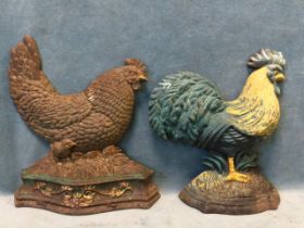 A painted cast iron cockerel doorstop on a shaped moulded base - 10.75in; and another flatback