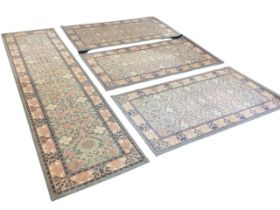 A set of three William Morris style Kelmscott pattern wool rugs - 33in x 62in, and a matching runner