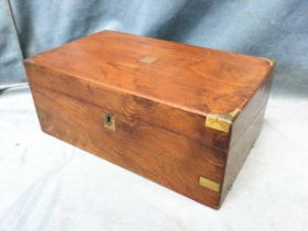 A Victorian walnut writing box with brass military style mounts, the interior with gilt tooled