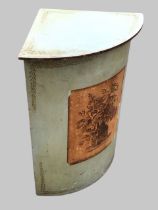 A painted bowfronted corner laundry basket, the hinged top above front panel with an engraving of