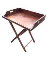 A Georgian mahogany butlers tray on stand, the rectangular platform with raised sides and pierced