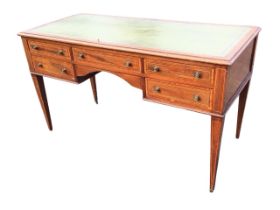 An Edwardian mahogany crossbanded writing desk, the rectangular top with gilt tooled leather skiver,