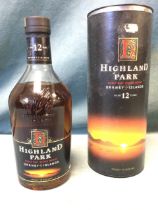 A boxed 1L bottle of Highland Park scotch whiskey, the liquor aged 12 years and 43% proof. (1L)