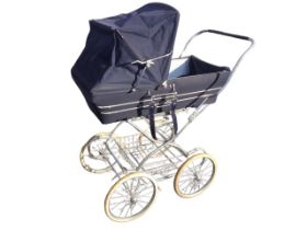 A Silver Cross pram, the detachable canvas body and folding hood with chromed fittings, on a tubular