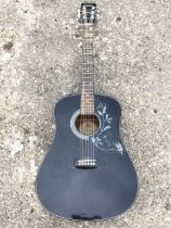 An ebonised Encore electro acoustic guitar with hummingbird type fingerplate and hardwood