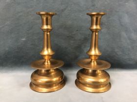 A pair of William & Mary style turned admiralty brass naval chaplains candlesticks, the knopped