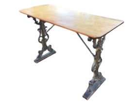 A Victorian mahogany and cast iron conservatory table, the rectangular top above pierced scroll cast