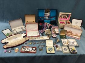 Miscellaneous jewellery including hallmarked silver and jet brooches, a hallmarked silver mirror