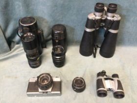 A pair of Horizon 12x-60x70 zoom binoculars; two leather cased camera lenses; a Practical camera;