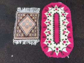 A small Afghan prayer rug with brown field having lozenge medallion enclosing hooked diamonds on a