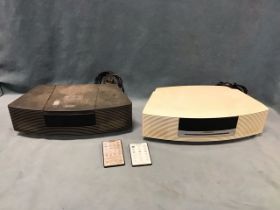 Two Bose wave radio CD machines, complete power cables and remotes. (2)