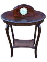 An Edwardian mahogany occasional table, the oval moulded top above a plain apron, raised on square