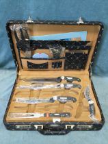 A cased set of Kaiserbach steel knives, scissors, forks, cleaver, sharpener, etc, unused in a fitted