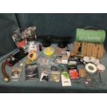 Miscellaneous fishing tackle including a tin tackle box, priests, nylon, hooks, lines, bait,