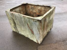 A large rectangular galvanised tank of riveted construction. (48in x 35in x 31.5in)