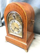 An Edwardian German Winterhalder & Hofmeier regency style walnut bracket clock, the gothic arched