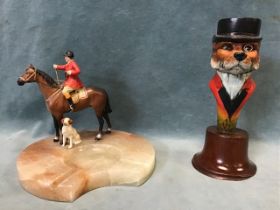 A 30s onyx ashtray mounted with a cold painted metal figure of a mounted huntsman and hound; and a