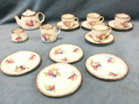 A boxed 50s ceramic dolls tea service by Wedgwood, with floral decoration and gilt highlights,