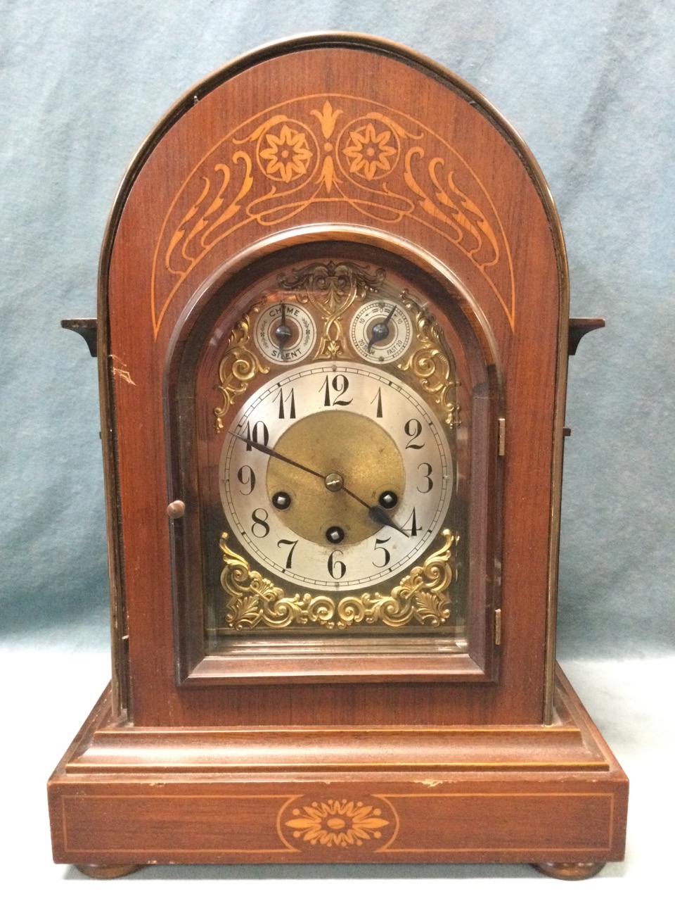A large late C19th domed top architectural style clock with art nouveau style decoration to