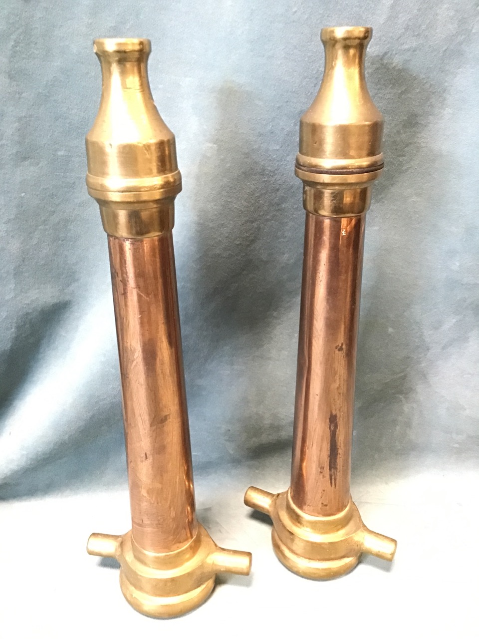 A pair of copper & brass firemans hose nozzles, the tapering tubes with Glasgow makers mark. (