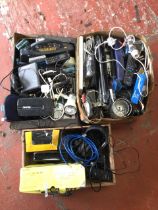 Three boxes of electrical gear - spotlights, battery charges, radios, adaptors, a sat nav system,