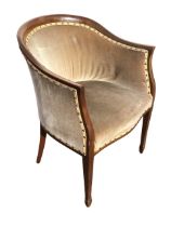 An Edwardian mahogany tub armchair by WH Harris, the horseshoe shaped back above a sprung