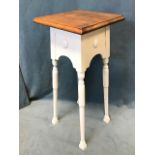 An Edwardian oak and painted plantstand, the moulded square top above shaped aprons with applied