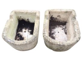 A pair of composition stone plain garden troughs of rectangular form with rounded D ends. (23in x