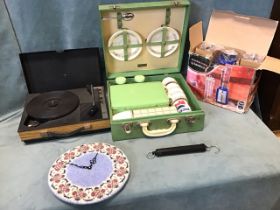 A 50s cased picnic set with thermos, food containers, cups, saucers, etc; a battery operated