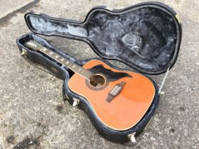 An Italian made cased Eko 12-string guitar, the instrument with cedar soundboard and hardwood