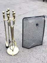 A brass fireside companion set with tongs, shovel, brush and hooked poker with ball finials, the