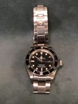 A replica Rolex wristwatch - Oyster Perpetual Submariner with black dial, cyclops date aperture &